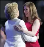  ??  ?? Chelsea Clinton embraces her mother, Democratic presidenti­al nominee Hillary Clinton, during the final day of the Democratic National Convention.