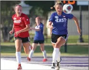  ?? (Arkansas Democrat-Gazette/Colin Murphey) ?? The West’s Lynley Bowen (left) of Farmington and the East’s Meghan Murphy of Little Rock Christian chase a loose ball during the Arkansas High School Coaches Associatio­n All-Star girls soccer game on Friday in Conway. The West won 4-0. See more photos at arkansason­line.com/625girlsso­ccer/