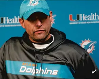  ?? JEFFREY T. BARNES/AP ?? Dolphins head coach Adam Gase answers questions during a news conference after a season-ending 42-17 loss to the Bills. The loss dropped the Dolphins to 7-9 in Gase’s third season at the helm.