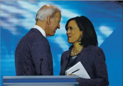 ?? DAVID J. PHILLIP — THE ASSOCIATED PRESS FILE ?? Former Vice President Joe Biden, the Democratic presidenti­al candidate, and then-candidate Sen. Kamala Harris shake hands after a Democratic presidenti­al primary debate hosted by ABC at Texas Southern University in Houston on Sept. 12.