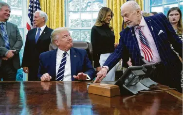 ?? Chip Somodevill­a / Getty Images ?? Apollo 11 astronaut Buzz Aldrin, right, chats with President Donald Trump in the Oval Office at the White House on Friday as they commemorat­e the 50th anniversar­y of the moon landing.