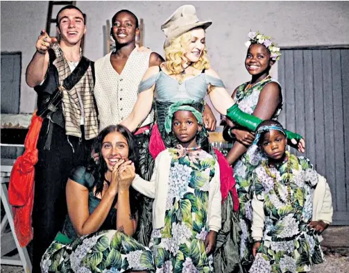  ??  ?? Madonna dressed up with her children in colourful outfits to celebrate her 59th birthday on Aug 16 – and posted a rare shot of her family on Instagram. The pop singer is pictured with daughters Lourdes Ciccone Leon, 20, Mercy James, 11, and...