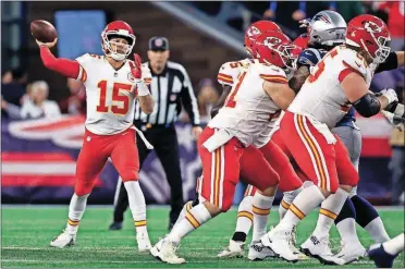  ?? [ASSOCIATED PRESS FILE PHOTOS] ?? ABOVE: Chiefs quarterbac­k Patrick Mahomes, left, passes behind blocking linemen during the first half against the Patriots on Sunday in Foxborough, Mass. RIGHT: NFL commission­er Roger Goodell speaks during a press conference after the NFL owners meetings Wednesday in New York.