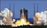  ?? (AP/Xinhua/Li Gang) ?? The Long March 5B Y3 carrier rocket, carrying Wentian lab module blasts off from the Wenchang Space Launch Center in Wenchang in southern China’s Hainan Province Sunday.