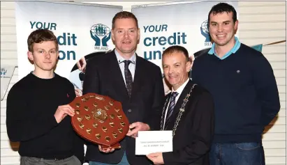  ??  ?? Tim Murphy, Kerry County Board chairman, and John Long, Chapter 23 chairman, made a presentati­on to Anto Kelliher and Tom Rohan, Castlegreg­ory GAA club, who won Division 5 of the County SFL in 2016. Photo by Michelle Cooper Galvin