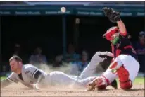  ?? AARON JOSEFCZYK — THE ASSOCIATED PRESS ?? The White Sox’s J.B. Shuck is safe at home plate as Indians catcher Chris Gimenez is unable to hang onto the ball during the seventh inning Sept. 25 at Progressiv­e Field.