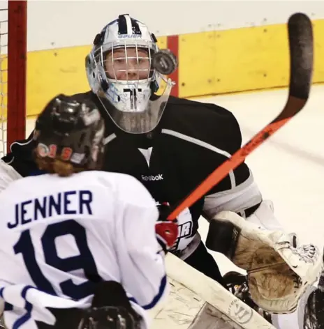  ?? ANDREW FRANCIS WALLACE/TORONTO STAR ?? Team Black goalie Christina Kessler follows the bouncing puck in front of Team White’s Brianne Jenner during CWHL all-star action Saturday at the ACC.