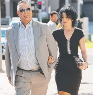  ?? Picture: GLENN HAMPSON ?? Former milk magnate Ken Lacey arrives at Southport Court yesterday, with girlfriend Arianne Stringer, for sentencing over cocaine matters. He didn’t walk out.