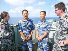  ??  ?? Royal Australian Navy sailors stand with officers from the Chinese Navy aboard the Royal Australian Navy frigate HMAS Newcastle during Australia’s largest maritime exercise ‘Exercise Kakadu’ being conducted off the coast of Darwin. — Reuters photo