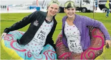  ?? Picture: WERNER HILLS ?? LET’S SPLASH OUT: Caitlin Anderson, left, and Laura Smith, are ready for a swim after the welcome weekend rains, during the Urban Run in Central on Sunday