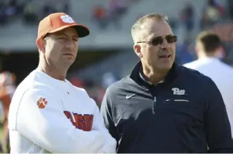  ?? The Associated Press ?? Clemson coach Dabo Swinney, left, said, “We respect every opponent.” Pitt coach Pat Narduzzi said of the Tigers, “They’re the benchmark of ACC football.”