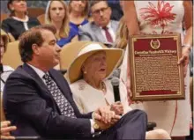  ?? STAN HUDY — SHUDY@DIGITALFIR­STMEDIA.COM ?? Marylou Whitney makes a few remarks with John Hendrickso­n sitting beside her after three Whitney, W.C. Whitney, H.P. Whitney and her late husband, C.V. ‘Sonny’ Whitney were inducted into the National Museum of Racing and Hall of Fame in the Pillar of the Turf category.