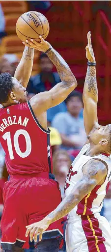  ?? EPA ?? Toronto Raptors guard DeMar DeRozan shoots against Miami Heat guard Rodney McGruder in the first half of their NBA game at the American Airlines Arena in Miami, Florida.