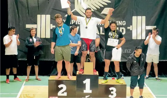  ??  ?? Commonweal­th Games hopeful, Joe Pomelile, centre, is one of three Papatoetoe Olympic Weightlift­ing Club lifters off to the Australian Open next month.