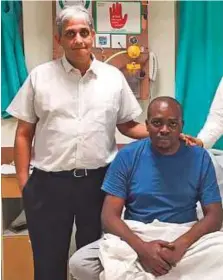  ??  ?? Dr K.R. Balakrishn­an (left), heart transplant surgeon from Fortis Hospital Chennai, with a patient.