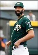  ??  ?? A’s pitcher Mike Fiers, who threw two perfect innings in his debut Sunday, said he appreciate­d fans’ positive responses.