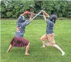  ?? SCOTT ASH/NOW NEWS GROUP ?? Physical contests are common, but there’s also a bake-off competitio­n at the Wisconsin Highland Games in Waukesha. Shown are John Charles Bauschatz, left, of Germantown and Kyle Boyea of Waukesha, sparring with German long swords during the games in 2019.