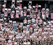  ?? DUANE BURLESON/GETTY ?? Fans at Detroit’s Comerica Park honor breast cancer survivors with signs of their names at a Tigers game last week.