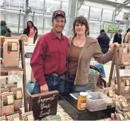  ?? COURTESY OF MEUER FARM ?? Dave and Leslie Meuer of Meuer Farm sell at the Milwaukee Winter Farmers Market. Dave said demand for beans has been huge and he plans to increase production.