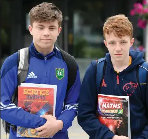  ??  ?? ABOVE: Liam Roos and Niall Lynch following Junior Cert Maths at St Michael’s College, Listowel and, right, Liam Quilter and Ryan Large with their Junior Cert papers.