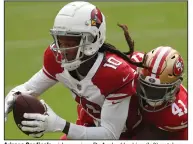  ?? (AP/Josie Lepe) ?? Arizona Cardinals wide receiver DeAndre Hopkins (left) catches a pass against San Francisco 49ers cornerback Emmanuel Moseley during the first half Sunday in Santa Clara, Calif. Hopkins had 14 receptions for 151 yards.