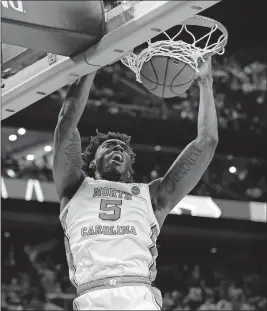  ?? [ADAM CAIRNS/DISPATCH] ?? North Carolina’s Nassir Little emphatical­ly scores two of his 20 points against Washington.