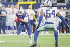  ?? Michael Ainsworth / Associated Press ?? Bills wide receiver Cole Beasley finds running room after catching a pass as Cowboys linebacker Jaylon Smith defends.
Associated Press