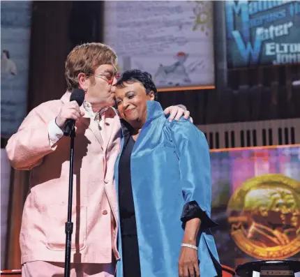  ?? PHOTOS PROVIDED BY SHAWN MILLER/LIBRARY OF CONGRESS ?? Elton John accepts his Gershwin Prize for Popular Song from Carla Hayden, the Librarian of Congress, at an all-star concert in Washington, D.C., on March 20.