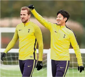  ?? — Reuters ?? Good to play: Strikers Harry Kane (left) and Son Heung-min arriving for Tottenham Hotspur’s training session in London yesterday. Spurs play Real Madrid at Wembley today.