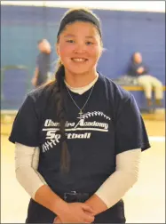  ?? Pete Paguaga / Hearst Connecticu­t Media ?? Cheshire Academy’s Aliya Catanzarit­a plays softball and has committed to play at Hofstra University. She was adopted when she was very young from Kazakhstan.