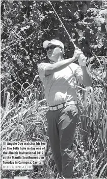  ??  ?? Angelo Que watches his tee on the 16th hole in day one of the Aboitiz Invitation­al 2017 at the Manila Southwoods on Tuesday in Carmona, Cavite.