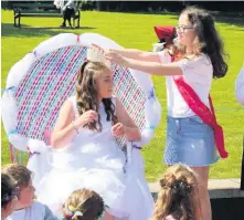  ??  ?? Crowned Last year’s Gala Queen Amy MacDonald hands over to this year’s Queen Olivia Reid