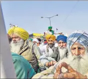  ??  ?? Farmers at Singhu border during their protest against the Centre's new farm laws, in New Delhi.