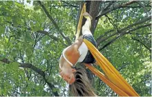  ?? CLIFFORD SKARSTEDT/ EXAMINER ?? Artist Jennifer 'Opal' Elchuk performs on an aerial silk.