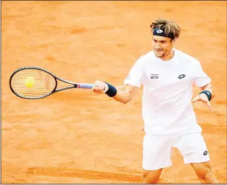  ??  ?? David Ferrer of Spain returns a ball to Alexandr Dolgopolov of Ukraine during the singles final match of the Swedish Open ATP tennis tournament in Bastad, Sweden, on July 23. (AFP)