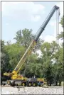  ?? Westside Eagle Observer/RANDY MOLL ?? A large crane was in place on the north side of Flint Creek on Monday in readiness to place bridge supports.