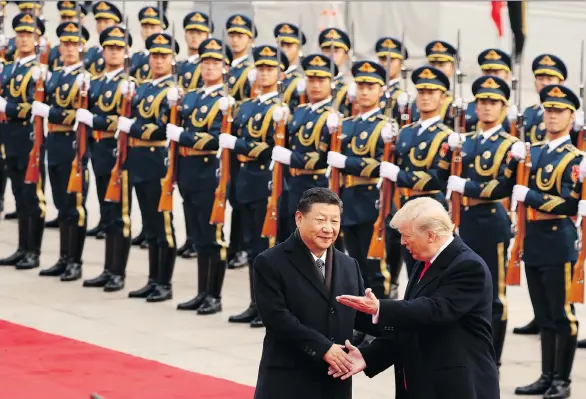  ?? THE ASSOCIATED PRESS FILES ?? U.S. President Donald Trump and Chinese President Xi Jinping participat­e in a welcome ceremony n Beijing. “The Chinese have an alternativ­e model for their investment­s and they’re increasing­ly going to be seen as the most important driver of other...
