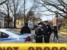  ?? STEPHANIE KEITH — THE NEW YORK TIMES ?? Police stand on the street where Francesco Cali was fatally shot outside his home on Staten Island, N.Y., on Wednesday. Anthony Comella was arrested Saturday in the killing.