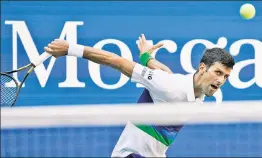  ?? AP ?? MAN ON A MISSION: No. 1 seed Novak Djokovic returns a shot against Kei Nishikori during his victory Saturday at Arthur Ashe Stadium.