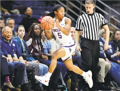  ?? Stephen Dunn / Associated Press ?? UConn’s Crystal Dangerfiel­d is averaging 13.7 points and a team-best 6.1 assists per game for the Huskies.