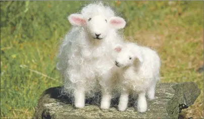  ?? AP PHOTO ?? These needle-felted sheep are from the book "Wool Pets" by Laurie Sharp. Needle felting is an easy craft to learn. "It can pretty quickly resemble something," says Sharp, of Suquamish, Wash.