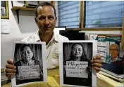  ?? SALVADOR MELENDEZ / AP ?? Eduardo Garcia is executive director of Pro-Busqueda, a group dedicated to minors missing since El Salvador’s civil war. He holds portraits of Salvadoran women who lost their siblings during the war.