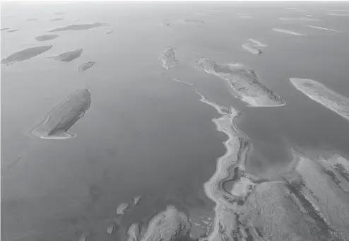  ?? JASON FRANSON / THE CANADIAN PRESS ?? Islands on the coast of the Adelaide Peninsula near Gjoa Haven, Nunavut. By this time next year, a dedicated research vessel will be moored nearby, devoted to the excavation of John Franklin’s flagship the Erebus, which will be one of the largest...