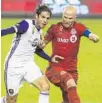  ?? CHRIS YOUNG/AP ?? Orlando City's Kaka, left, battles with Toronto FC's Michael Bradley during the teams’ 0-0 draw.