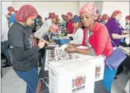  ?? Picture: SHANNON BRIGHT ?? CAPTION: More than 1 000 East Londoners rolled up their sleeves last year to pack 305 000 nutritious meal packs for the hungry in Buffalo City as part of a global Stop Hunger Now campaign