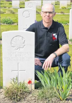  ?? SUBMITTED PHOTO ?? Bruce MacDonald at the grave of his father’s great-uncle, Private Robert Burns, 20th Battalion (Central Ontario), killed in action near Dickebusch, Belgium, on Nov. 25, 1915.