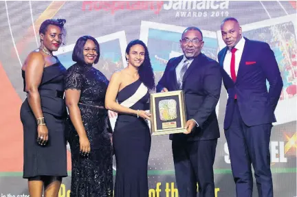  ?? PHOTO BY ASHLEY ANGUIN ?? Interim General Manager at the Montego Bay Convention Centre, Karron Benjamin (second right), presents the Best Opening of the Year Award to General Manager of the S Hotel, Lisa Gardner (centre) and her team.