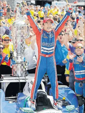  ?? AP PHOTO ?? Takuma Sato celebrates after winning the Indianapol­is 500 Sunday in Indianapol­is.