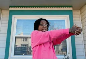  ?? AP ?? Briana Tyler uses her hands like a gun as she demonstrat­es the gunman shooting indiscrimi­nately, as she talks about witnessing the mass shooting at a Walmart yesterday.