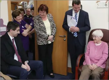  ??  ?? Maureen Kelly telling Minister for Health Simon Harris about Purple House Cancer Support Centre.